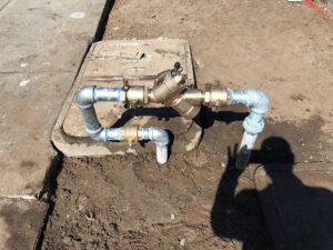 "Backflow prevention system being installed in Brisbane to safeguard water quality and public health.