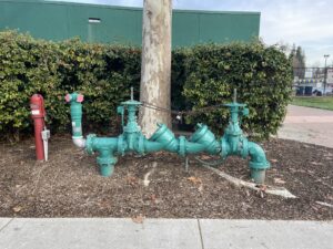 Plumber offering backflow services.