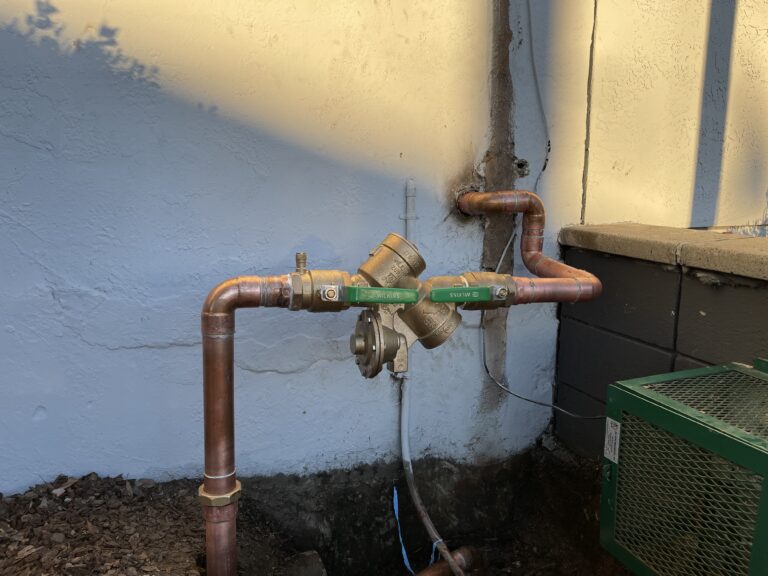 Installation of backflow prevention device in Oakland by professionals.