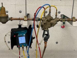 Image: A professional technician conducting backflow testing in South San Francisco, ensuring water safety and compliance with regulations.