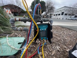 Image: A technician conducting backflow testing in San Bruno, ensuring water safety and compliance with regulations.